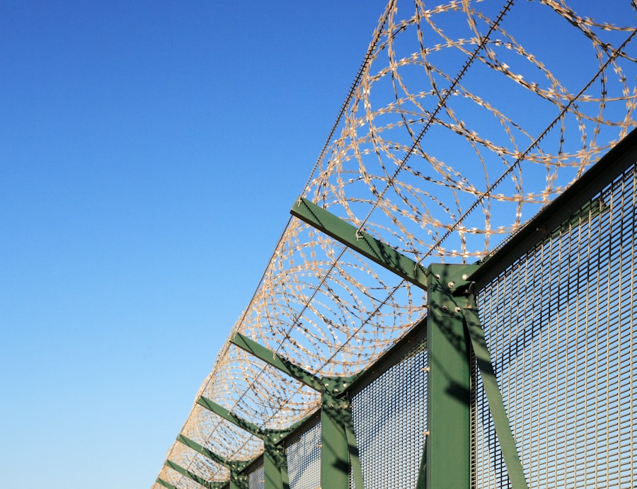 Security fencing topped with razor wire